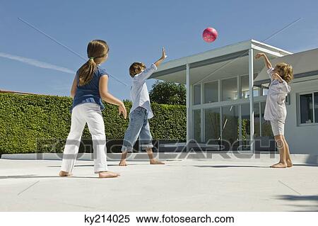Children playing with a ball View Large Photo Image Stock Photography - Children playing with a ball. Fotosearch