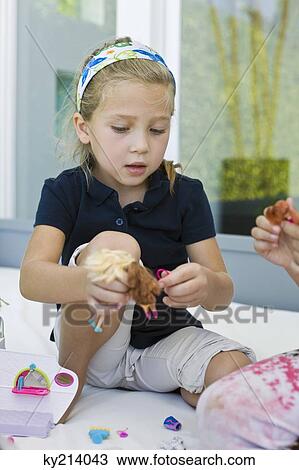 Girl playing with toys View Large Photo Image Stock Image - Girl playing with toys. Fotosearch
