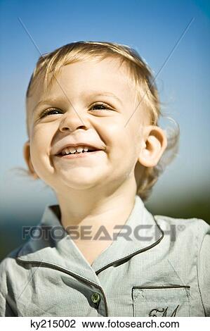 Stock Image - Close-up of a baby boy smiling. Fotosearch