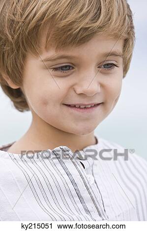 Close-up of a boy smiling View Large Photo Image Stock Image - Close-up of a boy smiling. Fotosearch
