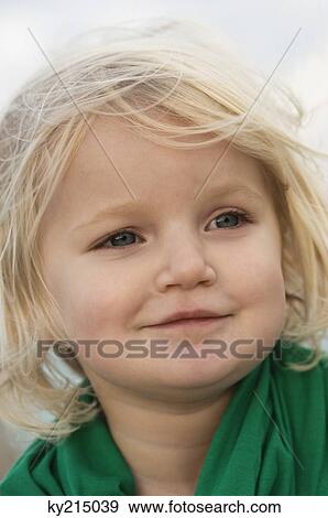 Stock Photo - Close-up of a girl smiling. Fotosearch