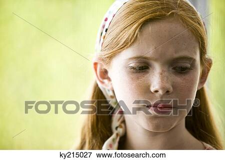 Close-up of a girl thinking View Large Photo Image Stock Photo - Close-up of a girl thinking. Fotosearch
