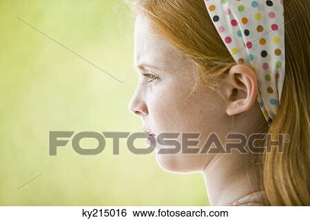 Close-up of a girl thinking View Large Photo Image Stock Photograph - Close-up of a girl thinking. Fotosearch