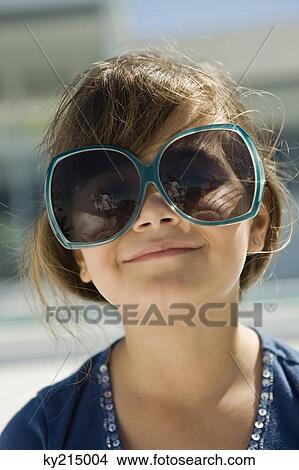 Picture - Girl wearing sunglasses. Fotosearch