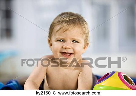 Stock Photo - Portrait of a baby boy smiling. Fotosearch