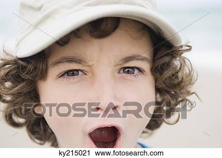 Stock Image - Portrait of a boy shouting. Fotosearch