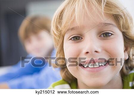 Stock Image - Portrait of a boy smiling. Fotosearch