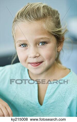 Stock Photo - Portrait of a girl grinning. Fotosearch