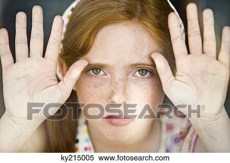 Stock Photography - Portrait of a girl showing her palms. Fotosearch