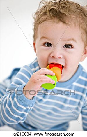 Baby boy playing with a toy View Large Photo Image Picture - Baby boy playing with a toy. Fotosearch