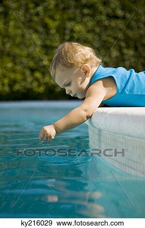 Baby boy playing with water View Large Photo Image Stock Photo - Baby boy playing with water. Fotosearch