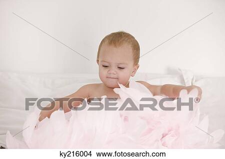 Baby girl playing with feathers View Large Photo Image Picture - Baby girl playing with feathers. Fotosearch