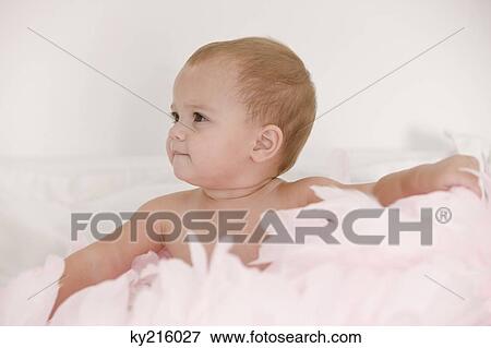 Baby girl playing with feathers View Large Photo Image Stock Photo - Baby girl playing with feathers. Fotosearch
