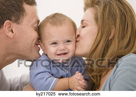 Parents kissing their daughter View Large Photo Image Stock Photography - Parents kissing their daughter. Fotosearch