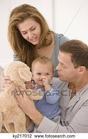 Parents playing with their daughter View Large Photo Image Stock Image - Parents playing with their daughter. Fotosearch