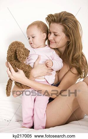 Woman playing with her daughter View Large Photo Image Stock Photography - Woman playing with her daughter. Fotosearch