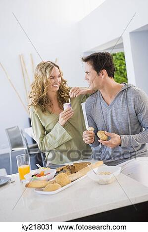 Stock Image - Couple at the breakfast table. Fotosearch