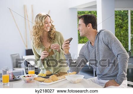 Couple at the breakfast table View Large Photo Image Stock Photo - Couple at the breakfast table. Fotosearch