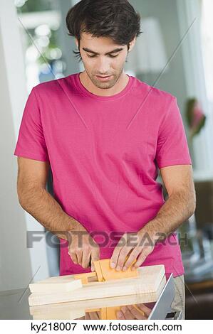 Man cutting cheese slices View Large Photo Image Stock Photo - Man cutting cheese slices. Fotosearch