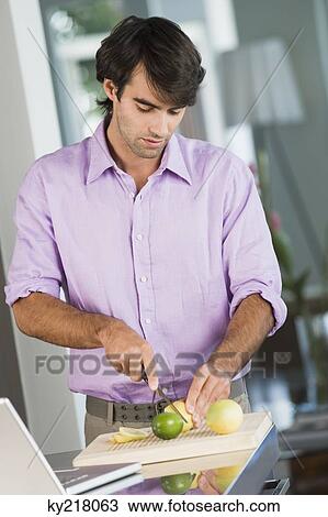 Man cutting lime slices View Large Photo Image Stock Image - Man cutting lime slices. Fotosearch
