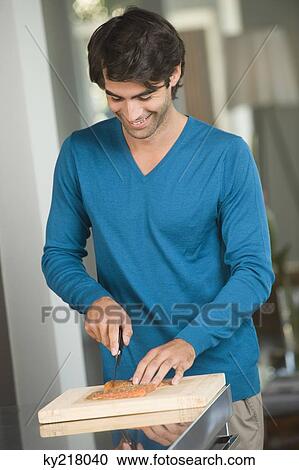 Man cutting salmon slices View Large Photo Image Stock Image - Man cutting salmon slices. Fotosearch