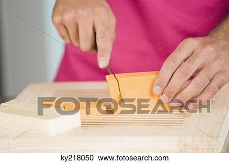 Woman cutting cheese slices View Large Photo Image Stock Image - Woman cutting cheese slices. Fotosearch