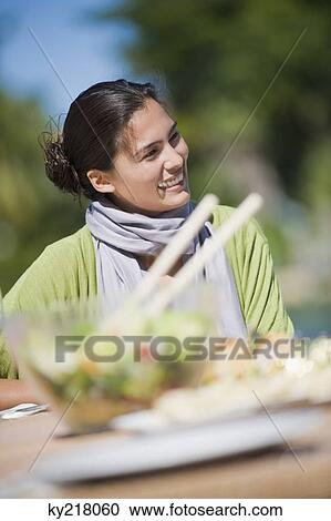 Woman having lunch View Large Photo Image Stock Image - Woman having lunch. Fotosearch