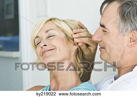 Stock Image - Close-up of a couple romancing. Fotosearch