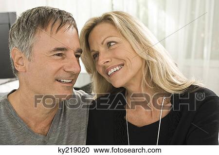 Close-up of a couple smiling View Large Photo Image Stock Image - Close-up of a couple smiling. Fotosearch