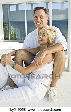 Close-up of a couple smiling View Large Photo Image Stock Photo - Close-up of a couple smiling. Fotosearch