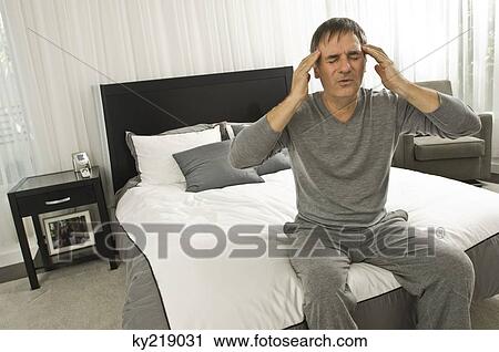 Man suffering from headache View Large Photo Image Stock Image - Man suffering from headache. Fotosearch