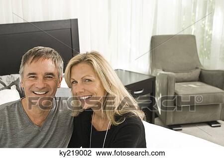 Portrait of a couple smiling View Large Photo Image Stock Image - Portrait of a couple smiling. Fotosearch