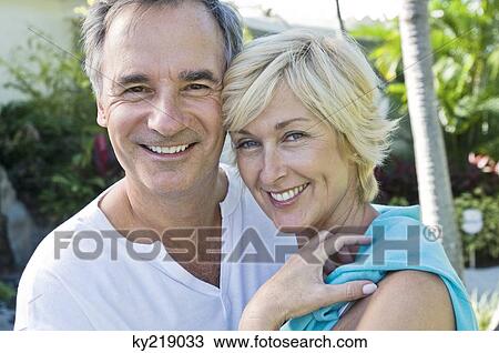 Portrait of a couple smiling View Large Photo Image Stock Image - Portrait of a couple smiling. Fotosearch