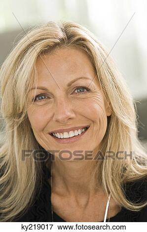 Portrait of a woman smiling View Large Photo Image Stock Photo - Portrait of a woman smiling. Fotosearch
