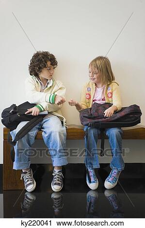 Boy and a girl playing together View Large Photo Image Stock Image - Boy and a girl playing together. Fotosearch