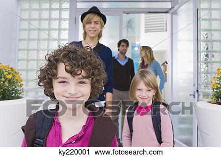 Children with a nanny leaving for school View Large Photo Image Stock Image - Children with a nanny leaving for school. Fotosearch