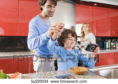 Family in the kitchen View Large Photo Image Picture - Family in the kitchen. Fotosearch