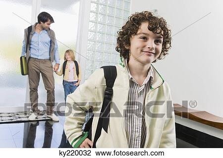 Man entering the house with his children View Large Photo Image Stock Image - Man entering the house with his children. Fotosearch