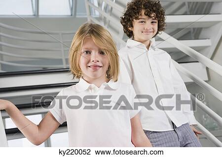 Portrait of a boy and a girl walking down stairs View Large Photo Image Stock Image - Portrait of a boy and a girl walking down stairs. Fotosearch