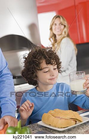 Boy having breakfast in the kitchen View Large Photo Image Stock Image - Boy having breakfast in the kitchen. Fotosearch