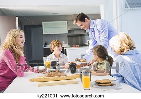 Family at the breakfast table View Large Photo Image Stock Image - Family at the breakfast table. Fotosearch