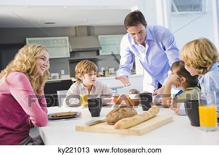 Family at the breakfast table View Large Photo Image Stock Image - Family at the breakfast table. Fotosearch