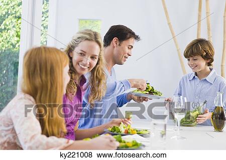 Family at the dining table View Large Photo Image Stock Photo - Family at the dining table. Fotosearch