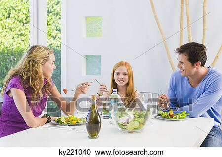 Family having lunch View Large Photo Image Stock Image - Family having lunch. Fotosearch