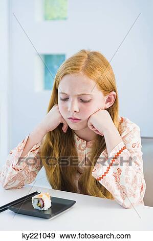 Girl at the dining table View Large Photo Image Stock Photo - Girl at the dining table. Fotosearch