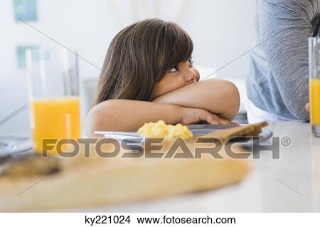 Girl with her father at the breakfast table View Large Photo Image Picture - Girl with her father at the breakfast table. Fotosearch