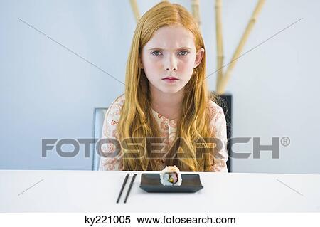 Portrait of a girl at a dining table View Large Photo Image Stock Photography - Portrait of a girl at a dining table. Fotosearch