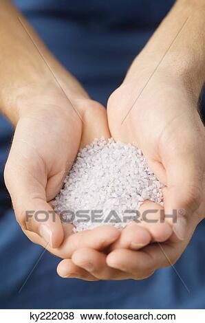Close-up of a person's hand holding himalayan salt View Large Photo Image Stock Photo - Close-up of a person's hand holding himalayan salt. Fotosearch