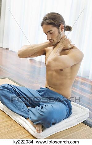 Man massaging his neck View Large Photo Image Picture - Man massaging his neck. Fotosearch
