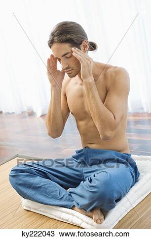Man massaging his temple View Large Photo Image Stock Image - Man massaging his temple. Fotosearch